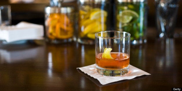 Traditional Sazerac cocktail, taken inside a bar.