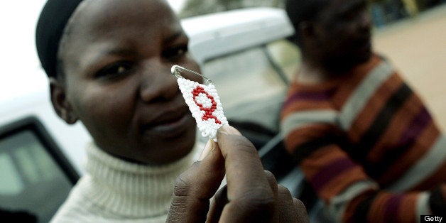 TO GO WITH AFP STORY IN FRENCH BY CHARLOTTE PLANTIVE Dineo Sumoke, member of the HIV+ support group in Gabane holds, 26 Septe