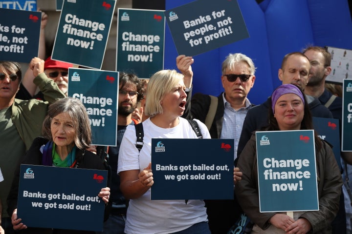 Protesters calling for banking reform at a rally to mark the 10th anniversary of the collapse of Lehman Brothers and the financial crisis, outside the Royal Exchange building in London