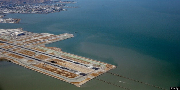 SAN FRANCISCO, CA - JULY 06: A Boeing 777 airplane lies burned on the runway after it crash landed at San Francisco International Airport July 6, 2013 in San Francisco, California. An Asiana Airlines passenger aircraft coming from Seoul, South Korea crashed while landing. There has been at least two casualties reported. (Photo by Ezra Shaw/Getty Images)