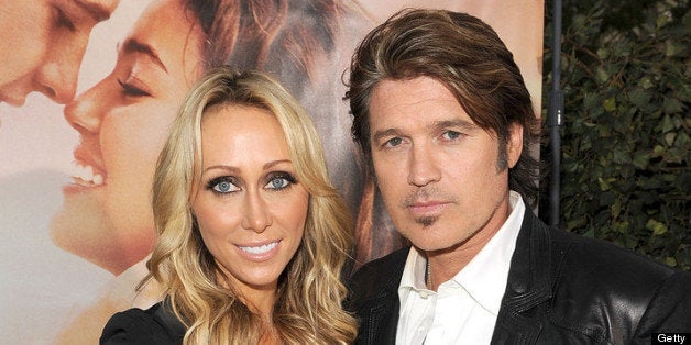 LOS ANGELES, CA - MARCH 25: Executive producer Tish Cyrus (L) and actor Billy Ray Cyrus arrive at the premiere of Touchstone Picture's 'The Last Song' held at ArcLight Hollywood on March 25, 2010 in Los Angeles, California. (Photo by Kevin Winter/Getty Images)