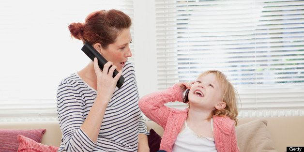 Mother and daughter on cell phones