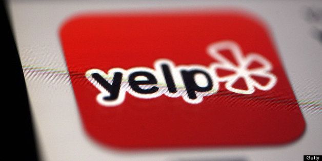 The Yelp Inc. app logo is displayed on an Apple Inc. iPad in Des Plaines, Illinois, U.S., on Tuesday, Feb. 5, 2013. Yelp Inc., owner of a website that lets consumers review local businesses, slipped after posting a wider quarterly loss than analysts estimated as it boosted spending on expansion into new markets. Photographer: Tim Boyle/Bloomberg via Getty Images