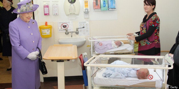 STEVENAGE, ENGLAND - JUNE 14: Queen Elizabeth II meets newborn babies as she visits a new maternity ward at the Lister Hospi