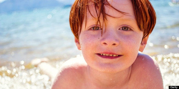 Young boy playing on the beach of Lake Tahoe