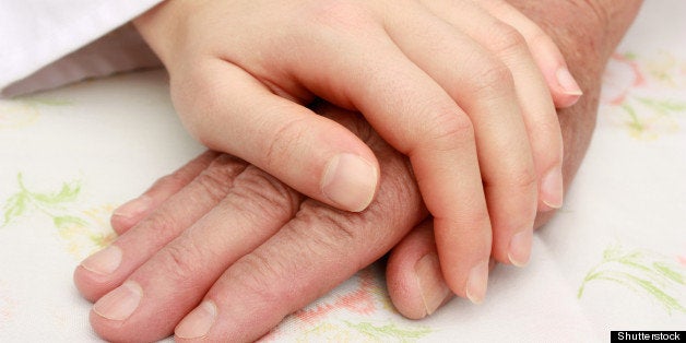helping the senior holding hand