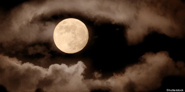 full moon over dark sky with.