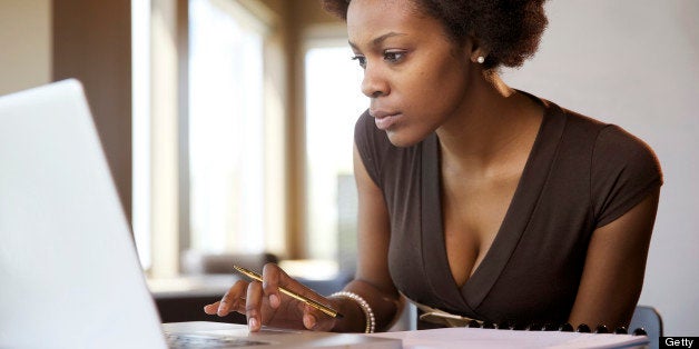 A businesswoman working on her laptop...