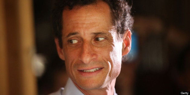 NEW YORK, NY - JULY 26: Anthony Weiner, a leading candidate for New York City mayor, speaks with residents in Staten Island on a visit to homes damaged by Hurricane Sandy on July 26, 2013 in New York City. It was recently revealed that Weiner engaged in lewd online conversations with a woman after he resigned from Congress for similar previous incidents. (Photo by Spencer Platt/Getty Images)