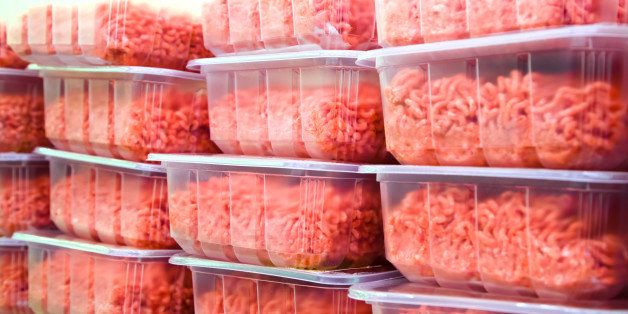 Ground Beef in plastic containers at a Meat Market
