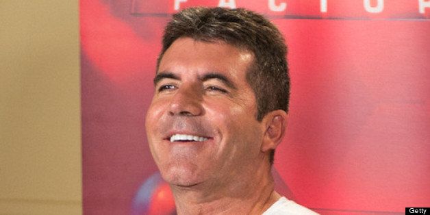 UNIONDALE, NY - JUNE 20: Simon Cowell attends 'The X Factor' Judges press conference at Nassau Veterans Memorial Coliseum on June 20, 2013 in Uniondale, New York. (Photo by Mike Pont/Getty Images)