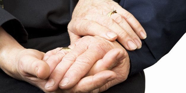 old couple holding hands