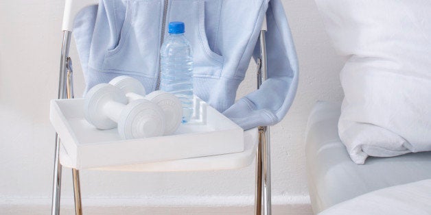 still life of sport equipment on chair beside bed