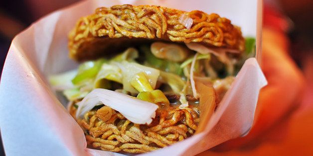 Fried and molded noodles with slices, onions, and bamboo shoots in between.