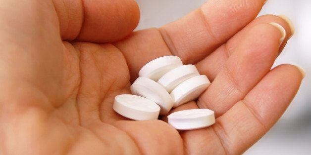 white round pills on hand