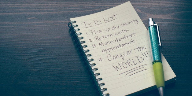 A pen and notebook with a humorous to do list.