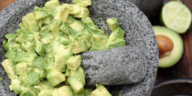 Guacamole in mortar with pestle