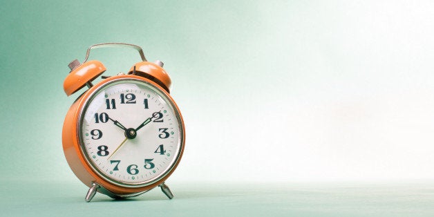 retro alarm clock on table on...