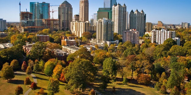 Atlanta skyscrapers as seen by a camera lofted by kite over Piedmont Park.In the foreground, park grass suffers from a drought that started in 2007.