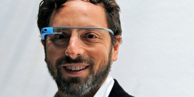 Sergey Brin, co-founder of Google Inc., stands for a photograph while wearing Project Glass internet glasses at the Diane Von Furstenberg fashion show in New York, U.S., on Sunday, Sept. 9, 2012. Google Inc., owner of the world?s most popular search engine, will sell eyeglass-embedded computers to consumers by 2014 after incorporating feedback from developers, said Brin. Photographer: Peter Foley/Bloomberg via Getty Images