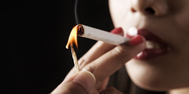 woman start smoking with...