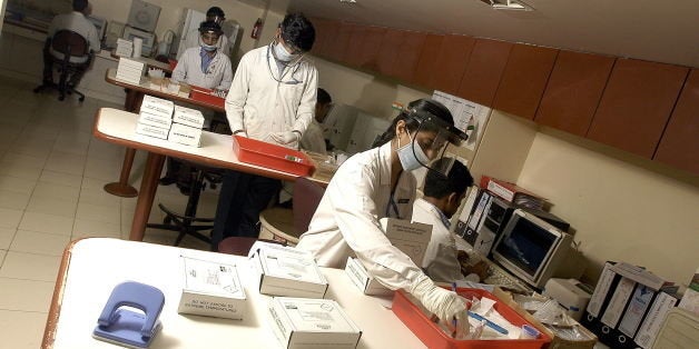 INDIA - AUGUST 29: Female scientist working at SRL Ranbaxy Laboratories (Ranbaxy Lab), in Mumbai, India (Photo by Soumik Kar/The India Today Group/Getty Images)