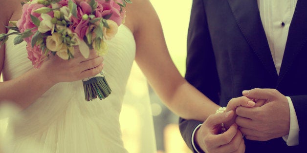 bride and groom holding hands