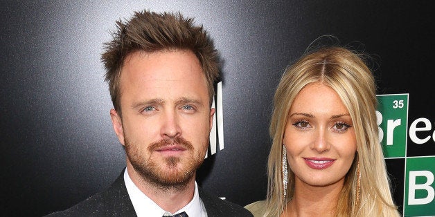 CULVER CITY, CA - JULY 24: Actor Aaron Paul (L) and his wife, Lauren Parsekian, arrive as AMC Celebrates the final episodes of 'Breaking Bad' at Sony Pictures Studios on July 24, 2013 in Culver City, California. (Photo by Imeh Akpanudosen/Getty Images)