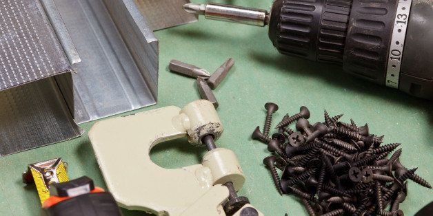 Plasterboard tools set with metal studs, screws, tape measure, rasp, screwgun and punch lock crimper