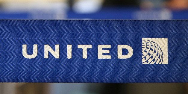 SAN FRANCISCO, CA - JULY 25: The United Airlines name is displayed on a barrier at San Francisco International Airport on July 25, 2013 in San Francisco, California. United Continental Holdings, the parent company of United Airlines, reported record revenues with second quarter earnings of $469 million. (Photo by Justin Sullivan/Getty Images)