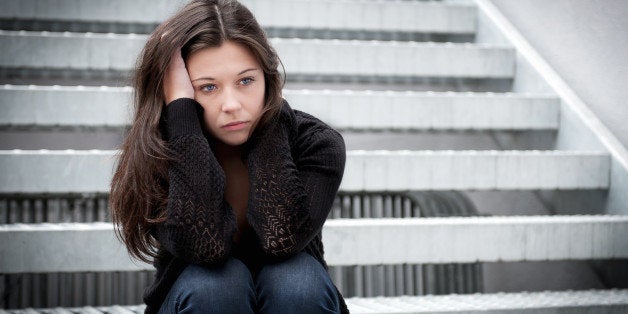 outdoor portrait of a sad...