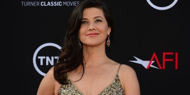 Daphne Zuniga poses on arrival for the American Film Institutes 41st Life Achievement Award Gala Tribute at the Dolby Theater in Hollywood, California, on June 6, 2013, where Mel Brooks was presented with the award, considered America's highest honour for a career in film. AFP PHOTO/Federic J. BROWN (Photo credit should read FREDERIC J. BROWN/AFP/Getty Images)