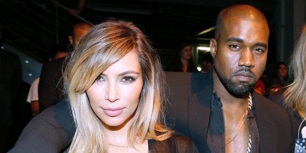 PARIS, FRANCE - SEPTEMBER 29: Kim Kardashian, Kanye West and singer Ciara attend Givenchy show as part of the Paris Fashion Week Womenswear Spring/Summer 2014, held at 'la Halle Freyssinet' on September 29, 2013 in Paris, France. (Photo by Bertrand Rindoff Petroff/Getty Images)