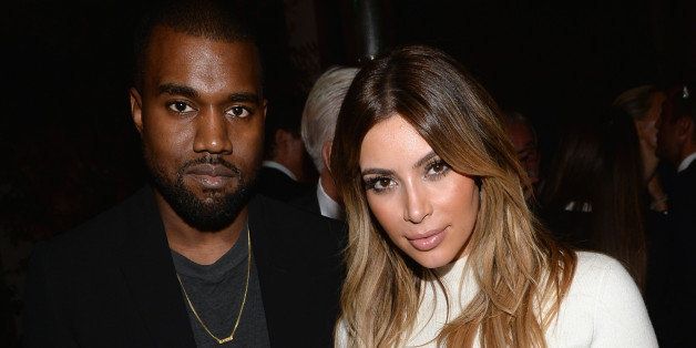 BEVERLY HILLS, CA - OCTOBER 24: Recording artist Kanye West and TV personality Kim Kardashian attend Dream for Future Africa Foundation Inaugural Gala honoring Franca Sozzani of VOGUE Italia at Spago on October 24, 2013 in Beverly Hills, California. (Photo by Michael Buckner/WireImage)