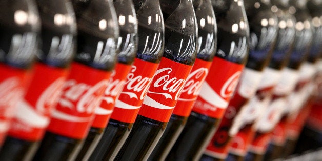 Bottles of Coca-Cola Co. soda are displayed at an E-Mart Co. store, a subsidiary of Shinsegae Co., in Seoul, South Korea, on Tuesday, Sept. 24, 2013. The South Korean economy faces headwinds, with record household debt and a sluggish housing market weighing on consumption. Photographer: SeongJoon Cho/Bloomberg via Getty Images