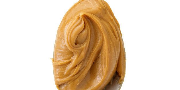 creamy peanut butter in a spoon