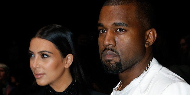 PARIS, FRANCE - MARCH 03: Kim Kardashian and Kanye West attend the Givenchy Fall/Winter 2013 Ready-to-Wear show as part of Paris Fashion Week on March 3, 2013 in Paris, France. (Photo by Bertrand Rindoff Petroff/GettyImages)