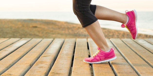 young woman is running in sunny ...