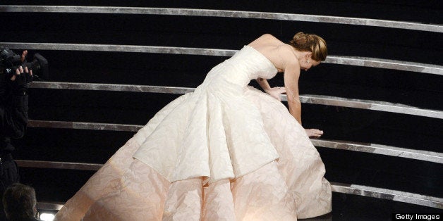 HOLLYWOOD, CA - FEBRUARY 24: Actress Jennifer Lawrence reacts after winning the Best Actress award for 'Silver Linings Playbook' during the Oscars held at the Dolby Theatre on February 24, 2013 in Hollywood, California. (Photo by Kevin Winter/Getty Images)