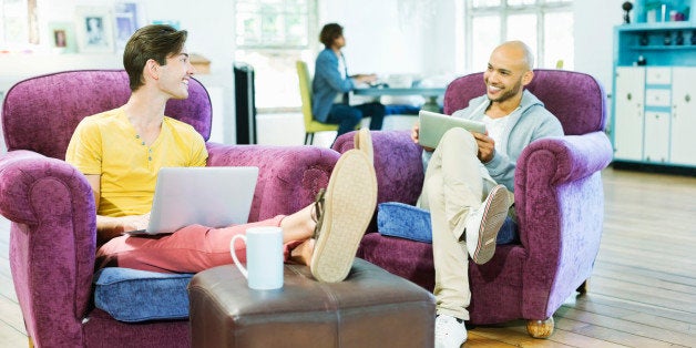 Men relaxing together in living room