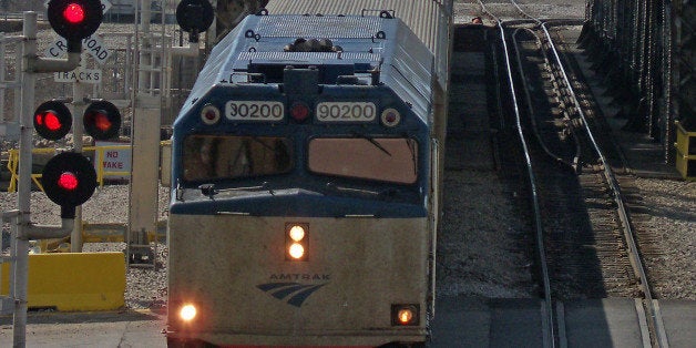 An Amtrak train heading to Union Station passes through the Canal Street Railroad Bridge