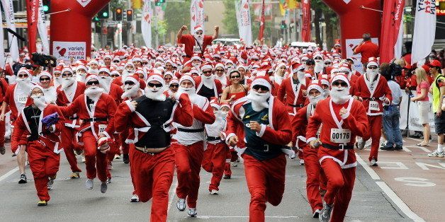 Three thousand Santa Clauses start the inaugural Santa Fun Run through Sydney on November 29, 2009. The world record attempt for the largest number of Santas together was also a charity event to raise money for children with disabilities and special needs. AFP PHOTO/Torsten BLACKWOOD (Photo credit should read TORSTEN BLACKWOOD/AFP/Getty Images)