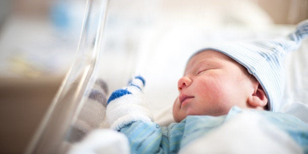 A third shot taken during the early days at the hospital. You can see the clothing marks on his cheek if you look closely.