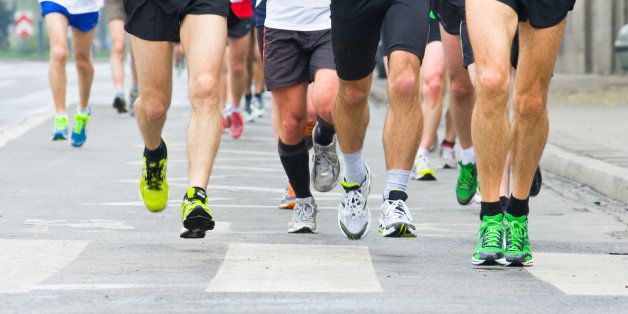 people running in city marathon