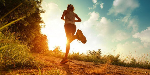 young lady running on a rural...