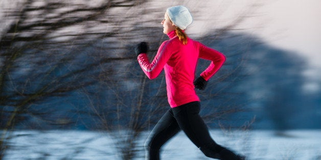 young woman running outdoors on ...