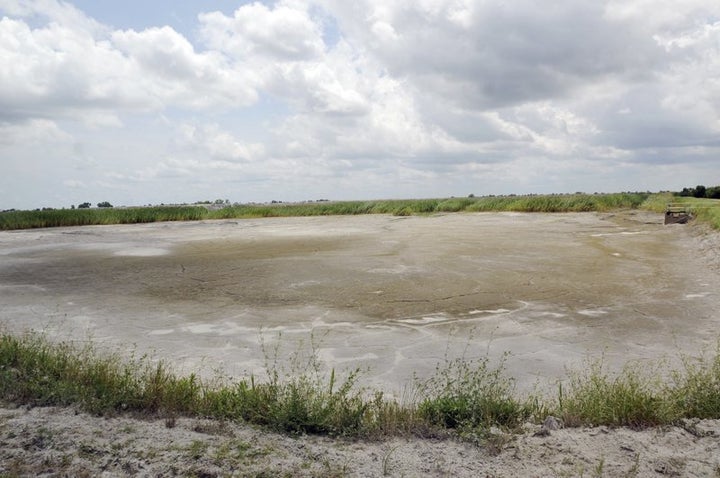 This photo, taken on June 23, 2014, shows the dried-up bed of an inactive coal ash pond at Duke Energy’s Sutton plant in Wilmington, N.C.