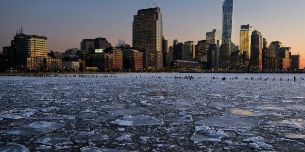 NEW YORK, NY - JANUARY 09: Ice floes fill the Hudson River as the Lower Manhattan skyline is seen during sunset on January 9, 2014 in New York City. A recent cold spell, caused by a polar vortex descending from the Arctic, caused the floes to form in the Hudson. (Photo by Afton Almaraz/Getty Images)