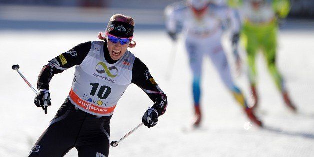 Second placed US Kikkan Randall sprints at the arrival of the Women 1.5 km Free Sprint during the Nordic skiing FIS Cross-country World Cup event on December 15, 2013 in Davos. AFP PHOTO / FABRICE COFFRINI (Photo credit should read FABRICE COFFRINI/AFP/Getty Images)