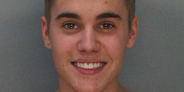 MIAMI, FL - JANUARY 23: In this handout photo provided by Miami-Dade Police Department, pop star Justin Bieber poses for a booking photo at the Miami-Dade Police Department on January 23, 2014 in Miami, Florida. Justin Bieber was charged with drunken driving, resisting arrest and driving without a valid license after Miami Beach Police found the pop star street racing on Thursday morning. (Photo by Miami-Dade Police Department via Getty Images)